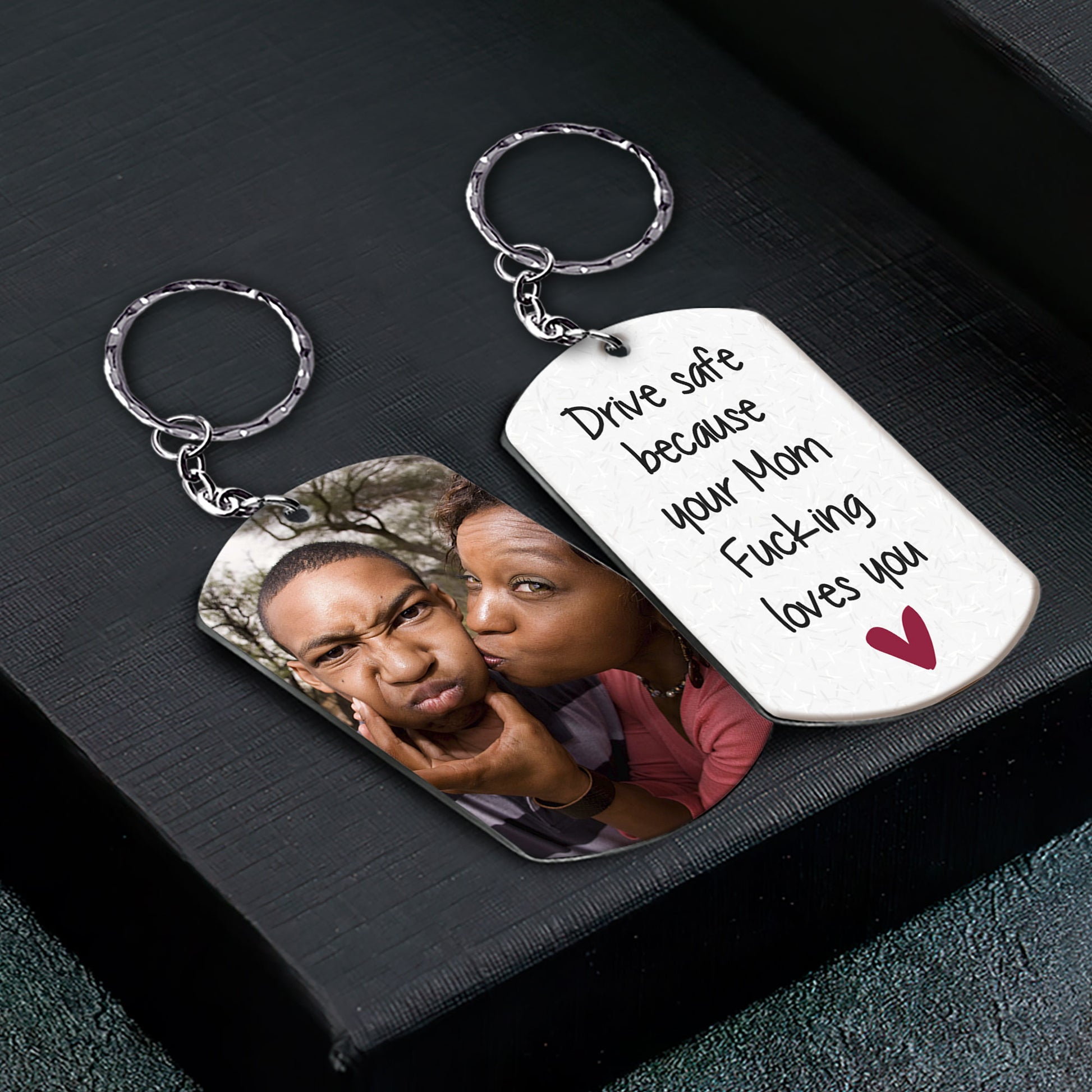 https://macorner.co/cdn/shop/files/Drive-Safe-Because-Your-Mom-Fucking-Loves-You-Personalized-Keychain_2.jpg?v=1689559999&width=1946