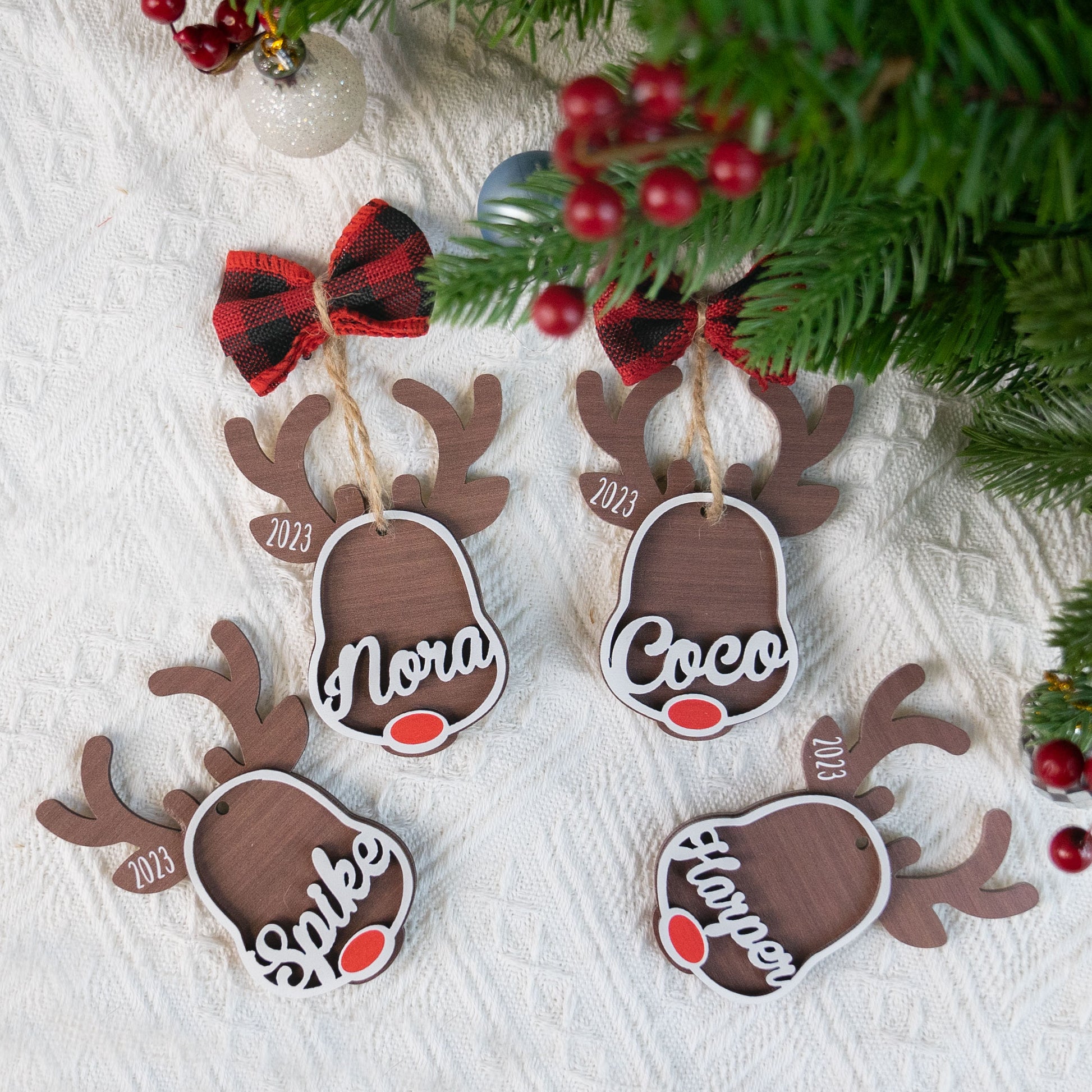 https://macorner.co/cdn/shop/files/Rudolph-Reindeer-Custom-Kids_-Names-Personalized-2-Layers-Wooden-Ornament-With-Bow_2.jpg?v=1693453068&width=1946